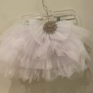 Tulle skirt with a brooch attached
